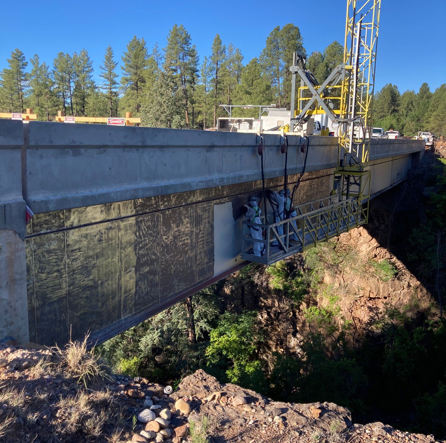 Team Hanging Off Bridge